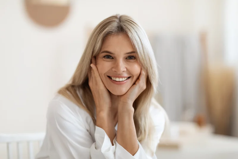 woman smiling and showing her clean face