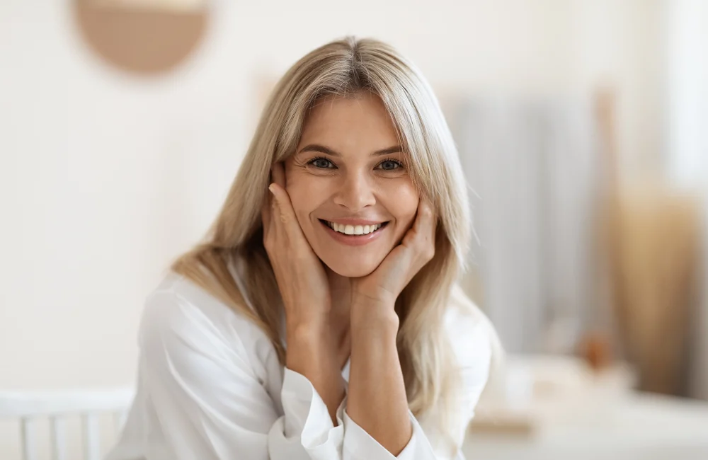 woman smiling and showing her clean face