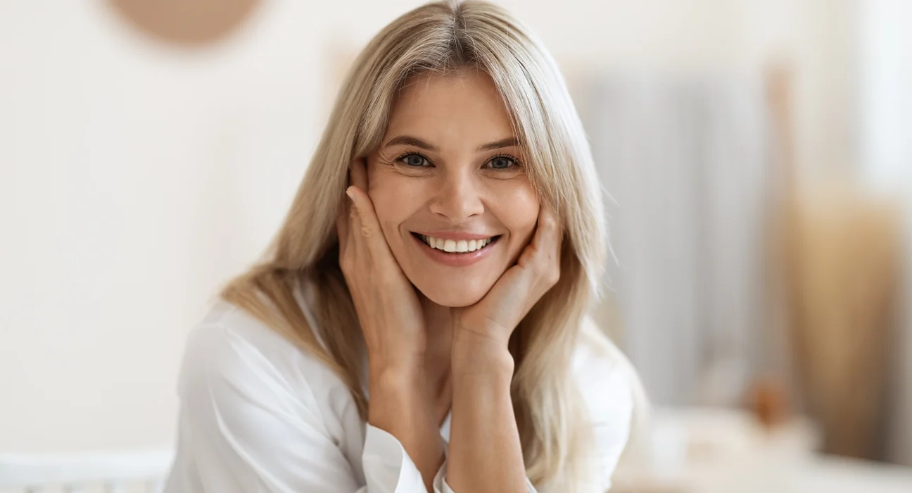 woman smiling and showing her clean face
